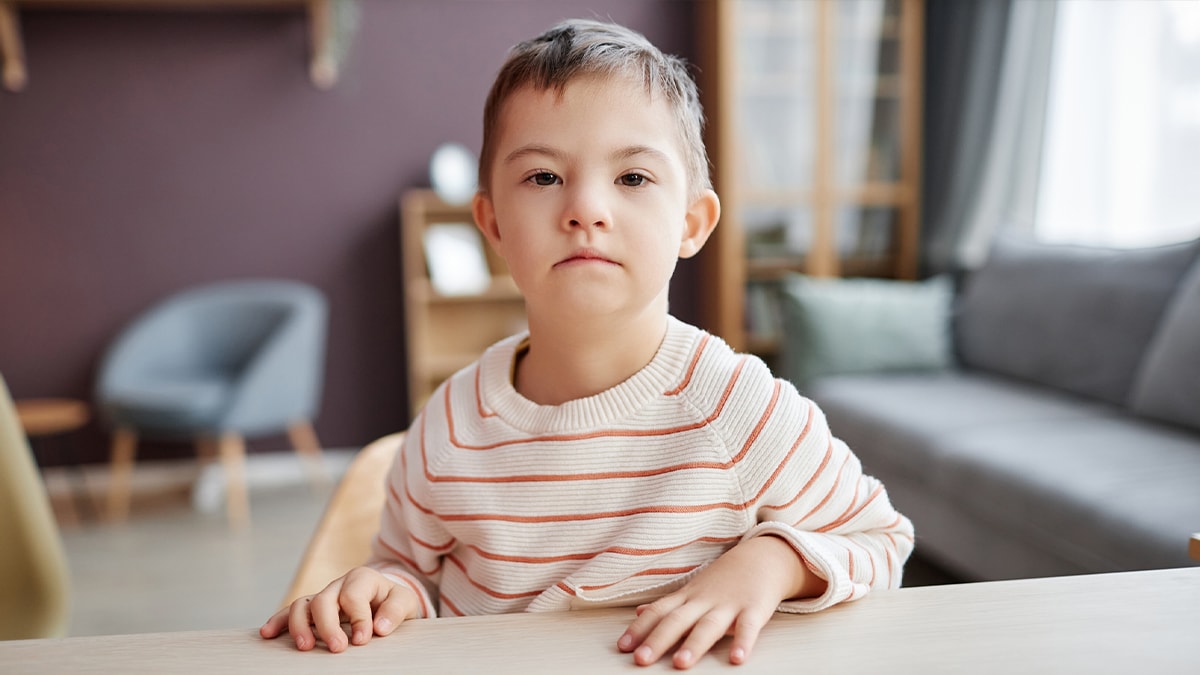 kid with disability looking at camera