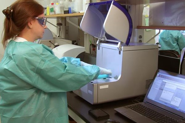 person in lab using equipment