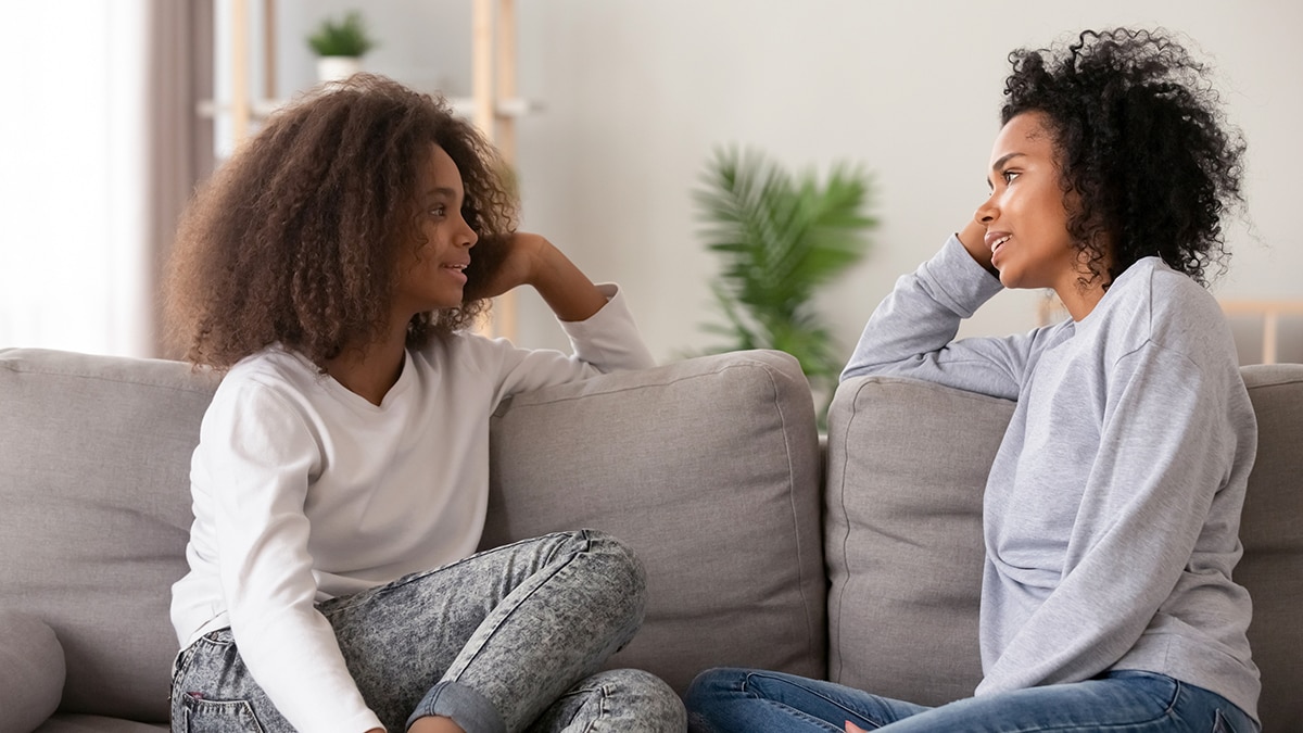 a mother and daughter in a serious conversation