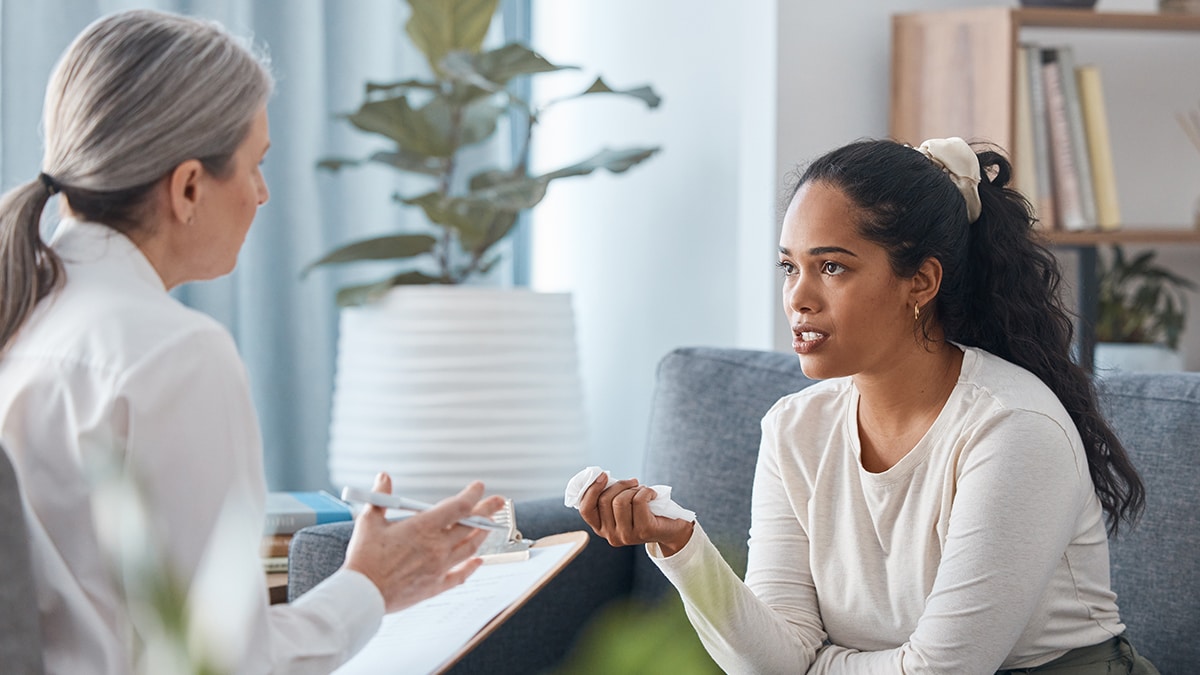 A woman talking to a genetic counselor