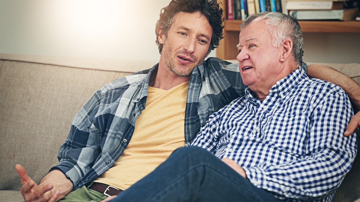 a man talking to his elderly father