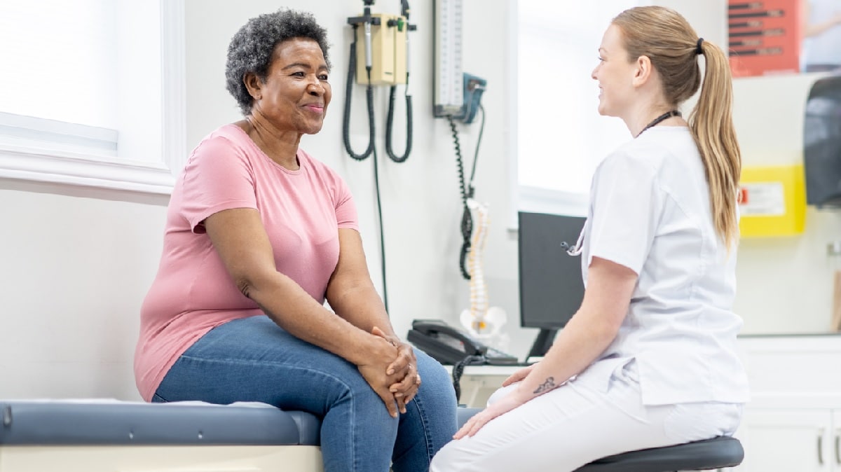 A doctor talking to a woman patient