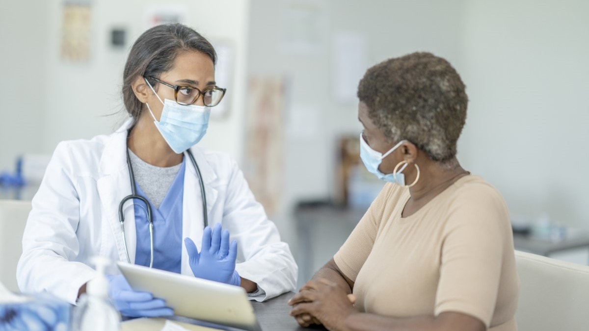 a woman talking to her doctor