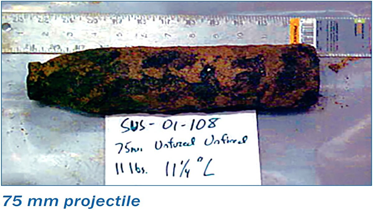 This image shows a recovered rust encrusted munition.