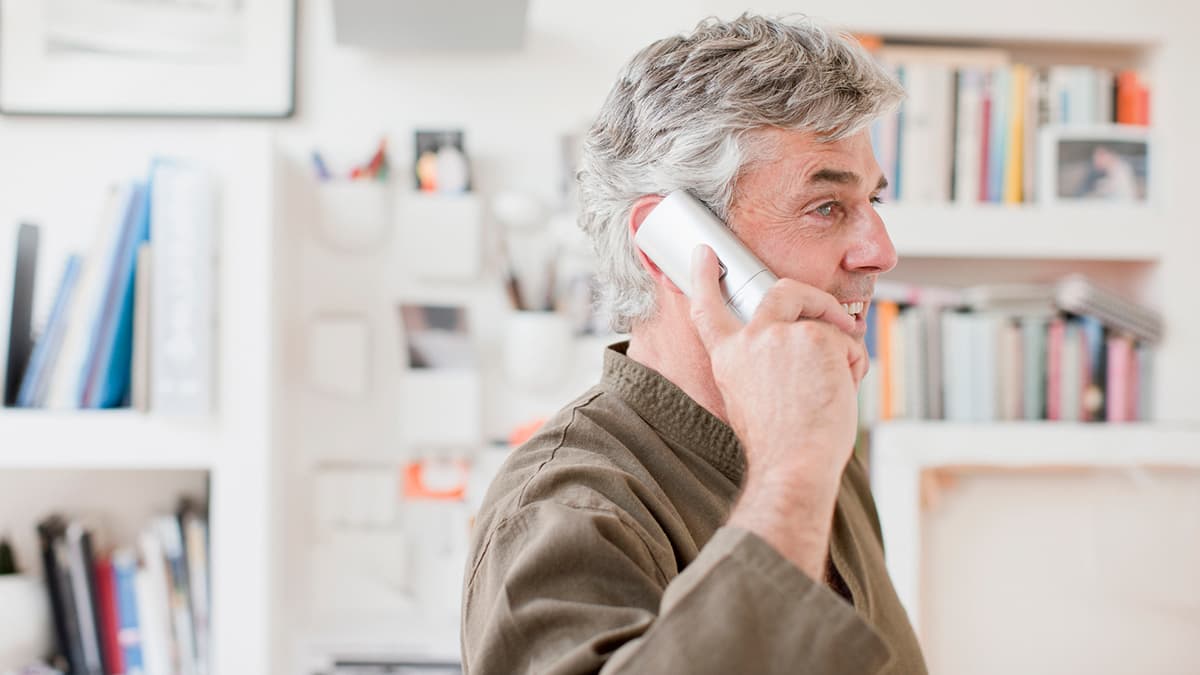 a man talking on a telephone