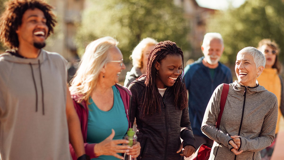 Smiling group of people walking together outdoors