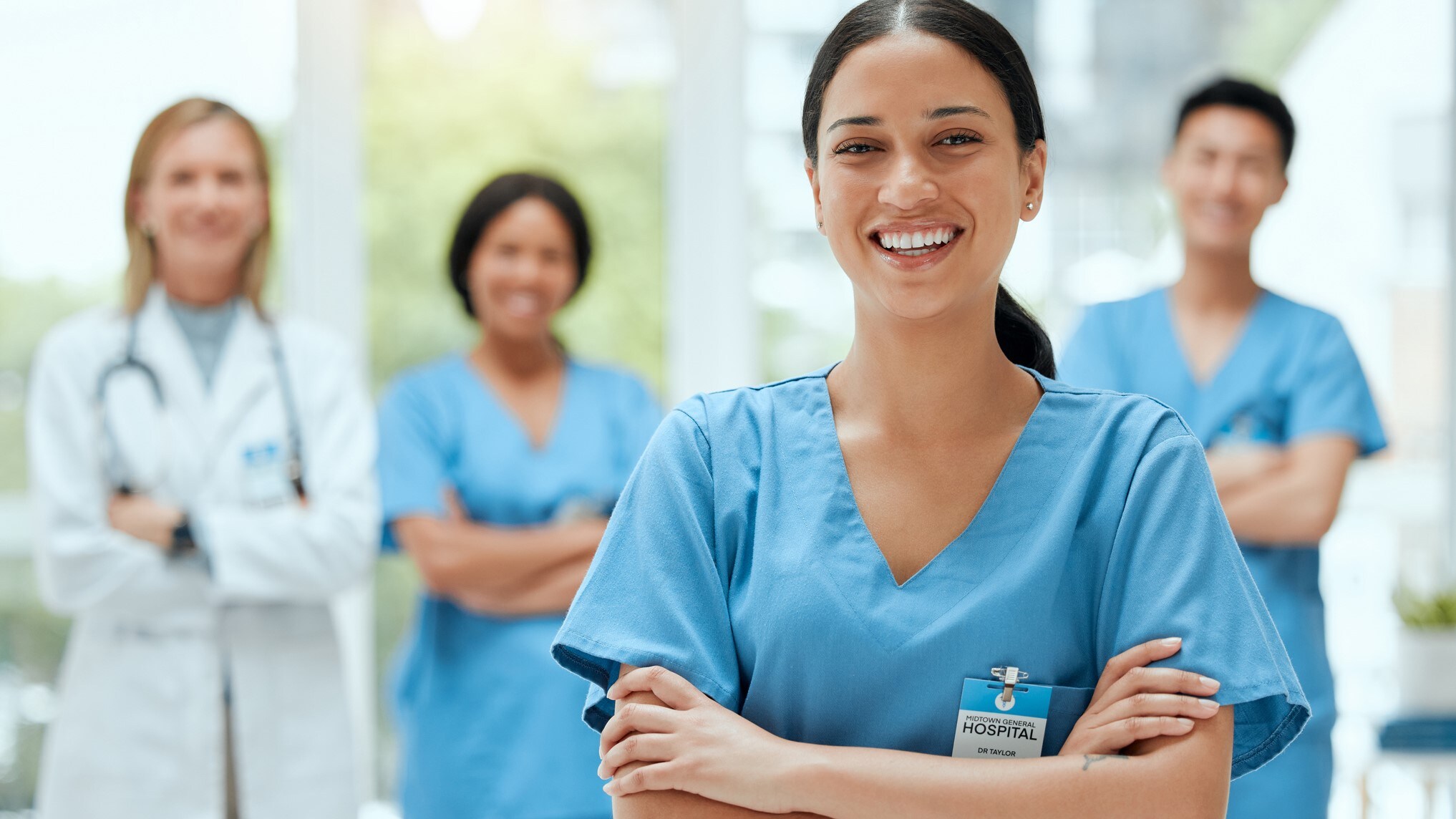 A group of health care providers standing in a hospital