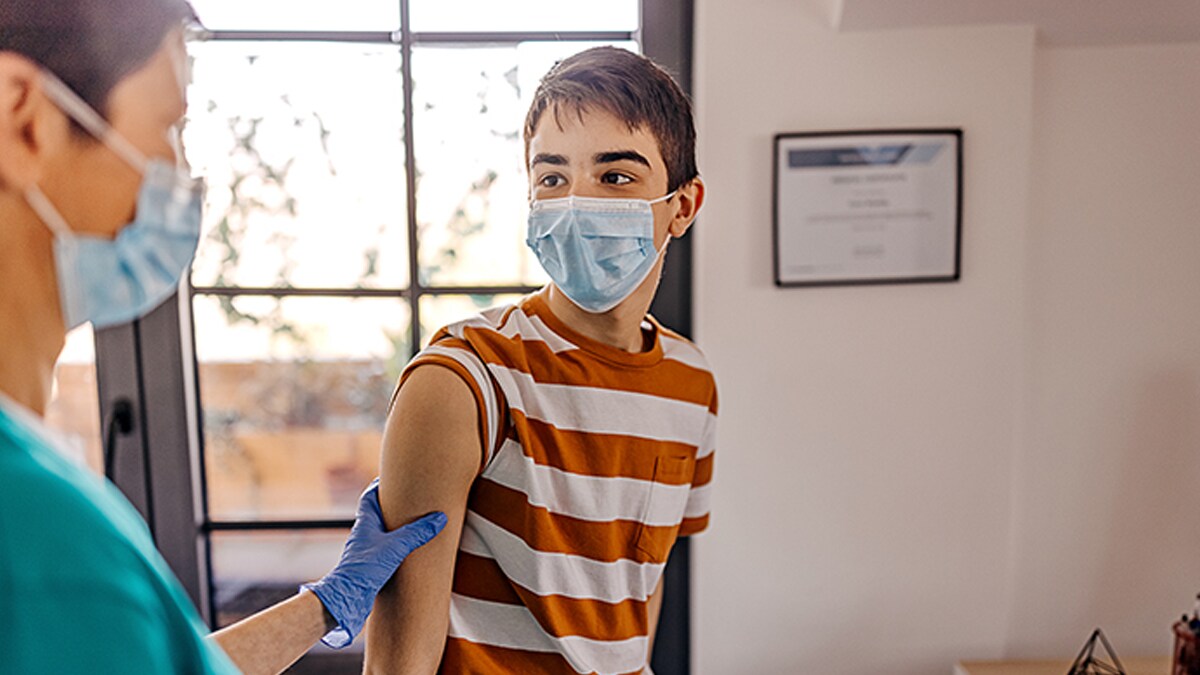 boy at doctor's getting vaccination