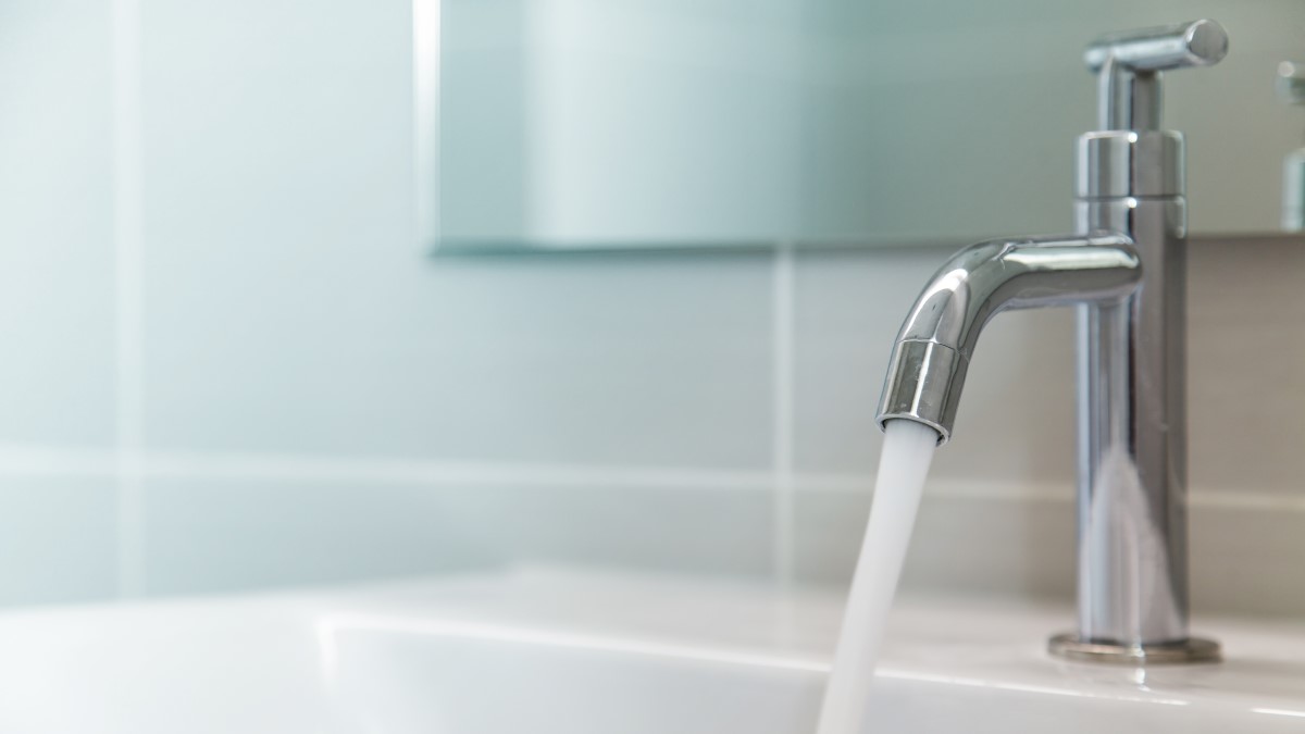 Running water faucet Water running from a bathroom faucet