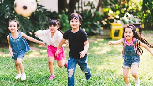 Children playing with a soccer ball.