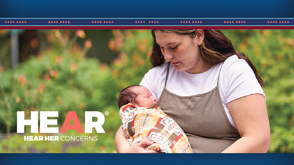 Woman holding baby.