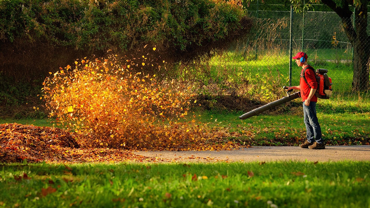 man using leaf blower