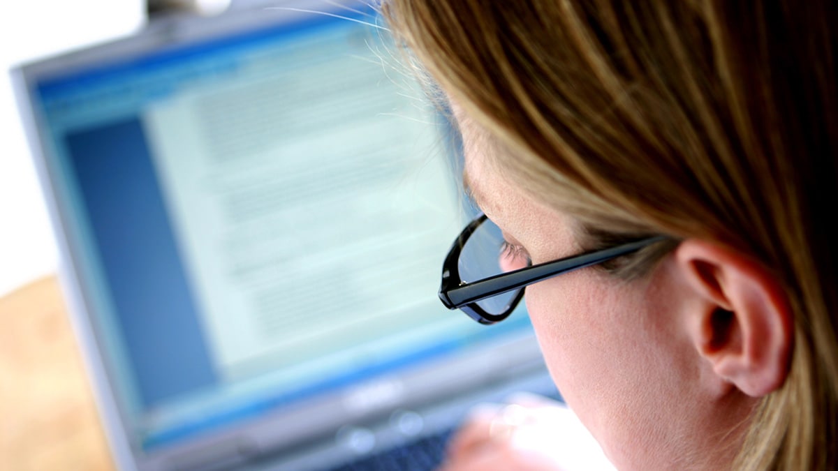 A person typing on a computer