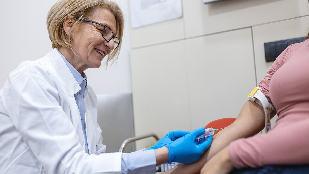 A doctor preparing to collect a sample from a patient for medical testing