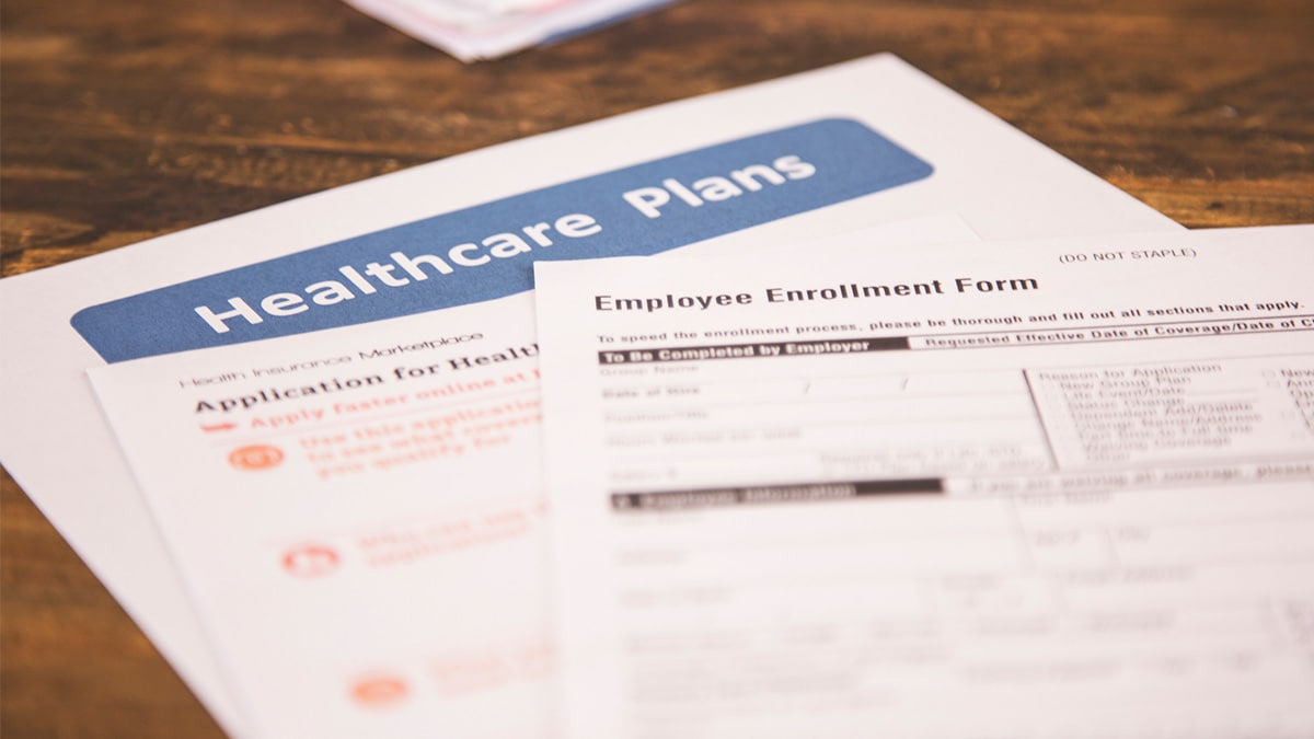 Healthcare coverage plan paperwork on a table.