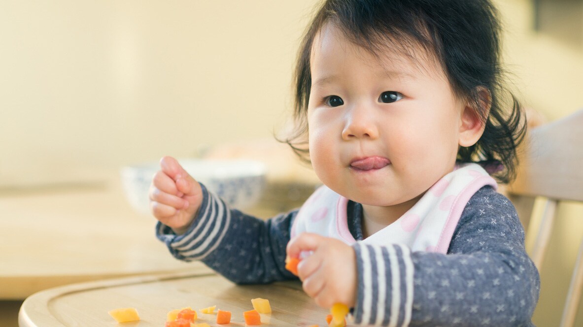 A child excited to see food.