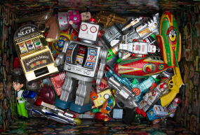 A box of old colorful metal toys.