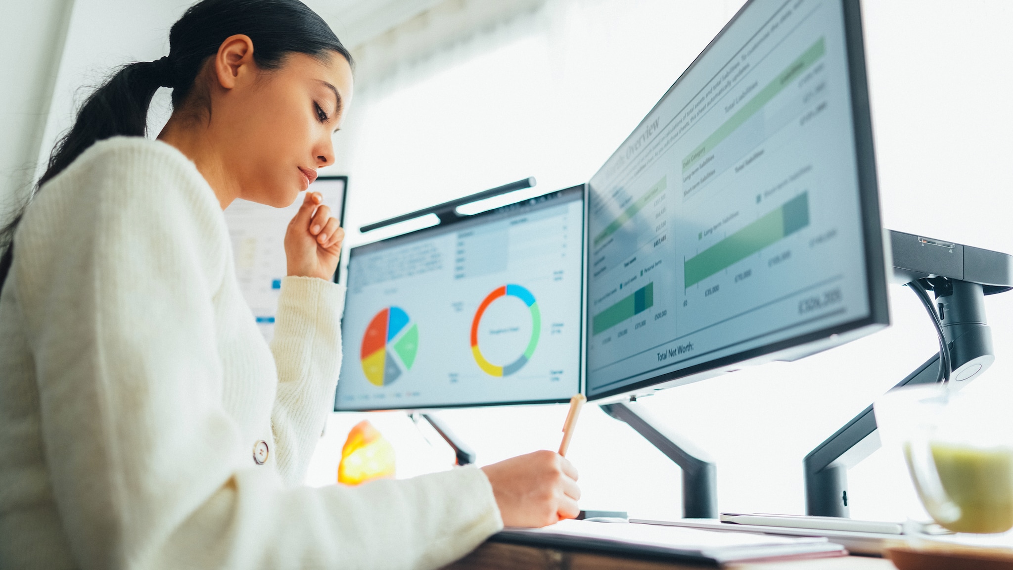 Female epidemiologist working on data on computer.