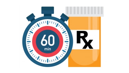 Stopwatch reading 60 minutes next to high blood pressure medication