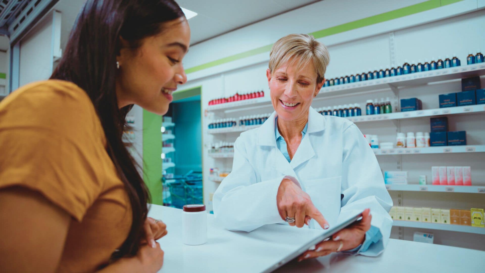 Woman talking with a pharmacist about medication use