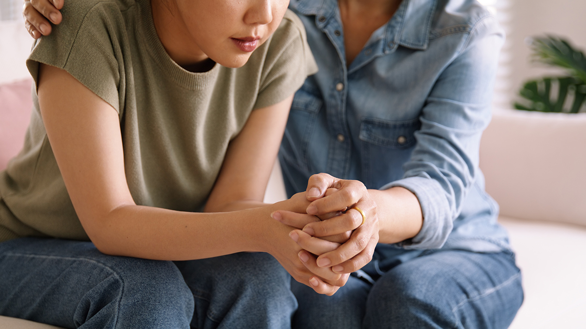 One person supporting another person