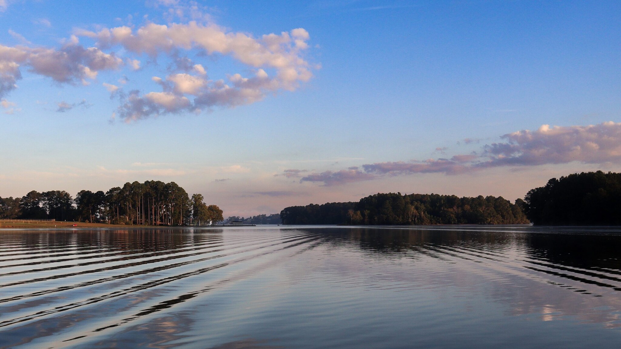 A still lake with a few ripples.