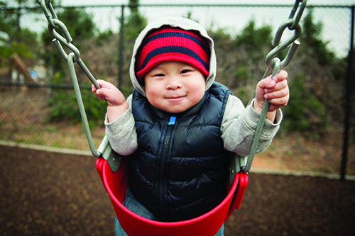 18 month old  in a swing
