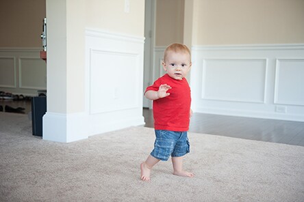 15 month old baby walking and waving