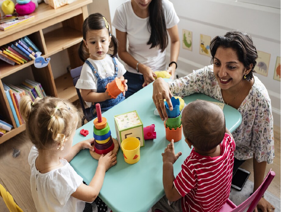 children playing with teacher