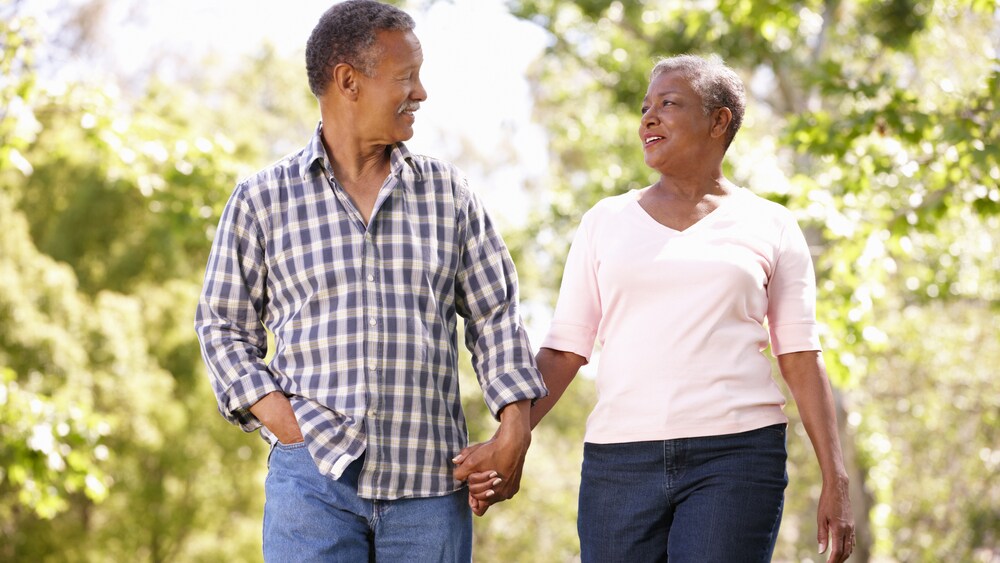 Middle aged man and woman walking