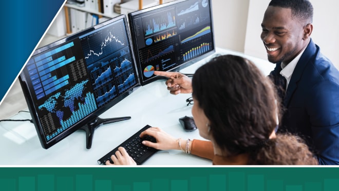 Two colleagues in an office sit at a computer and view data figures on two monitors with green data bar overlay