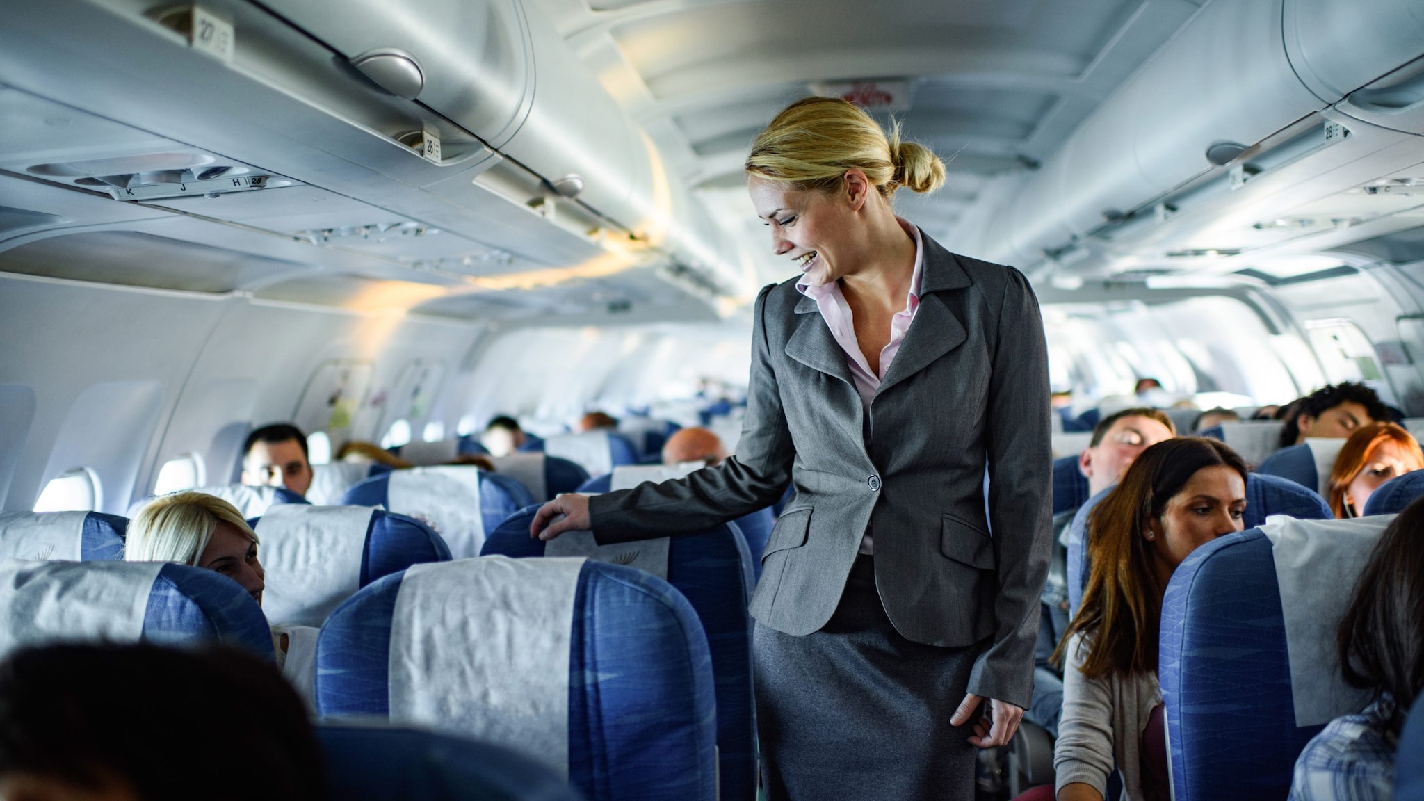 Female aircrew member on board a plane.