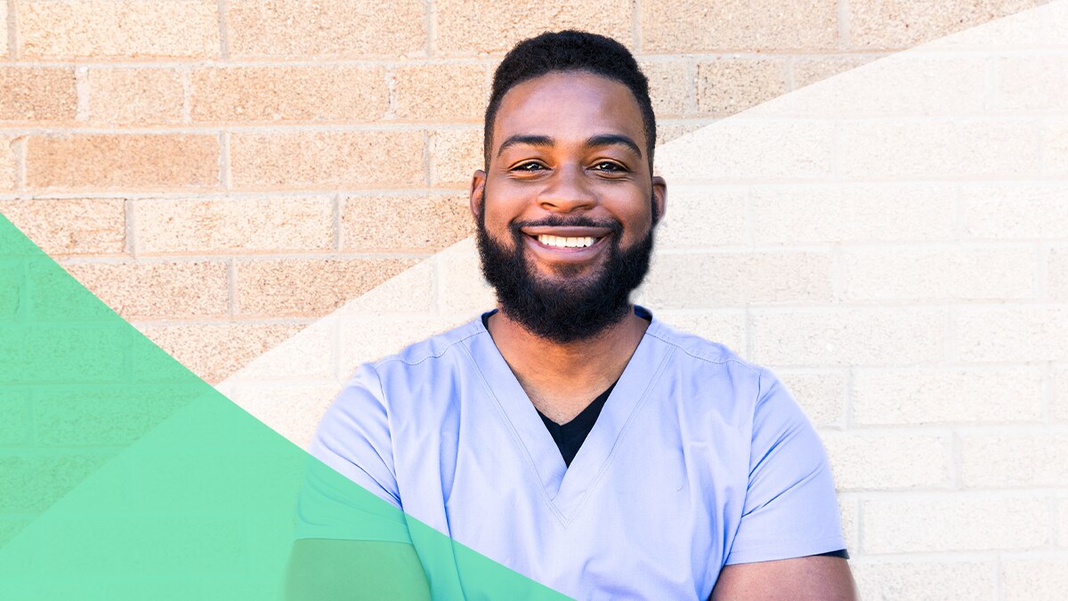 Portrait of smiling African American man in scrubs.