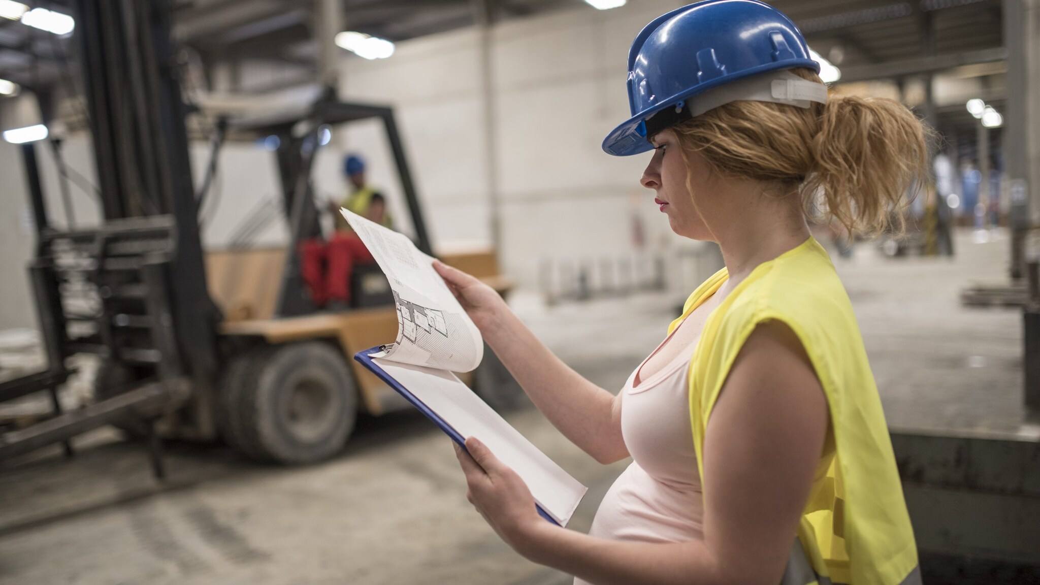 A pregnant warehouse worker.