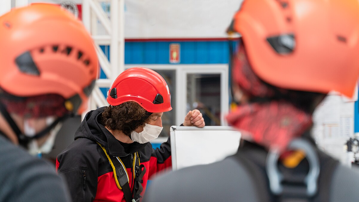 worker wearing hard hat leading training