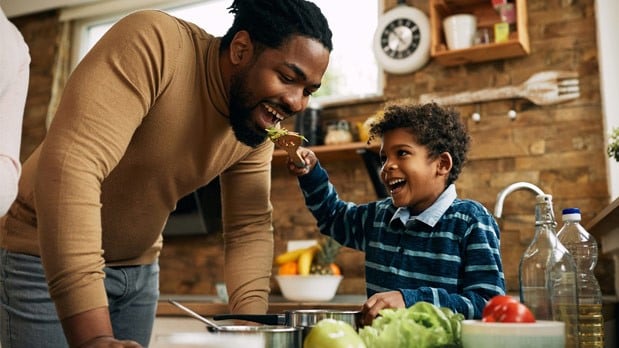 Father and son eating a healthy meal.