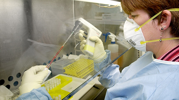 SARS lab worker Lab worker conducting experiment