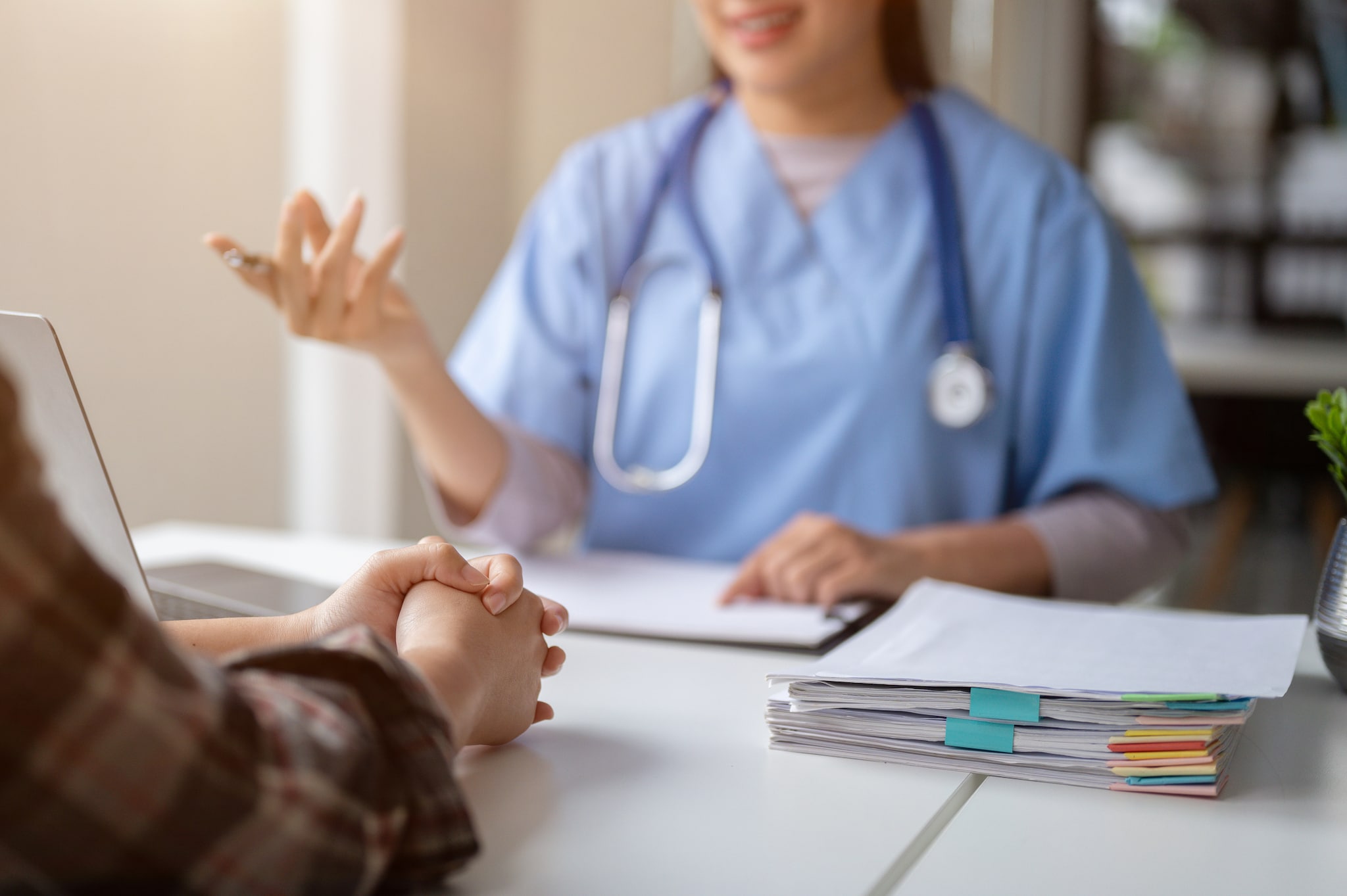 Clinician talking with patient.