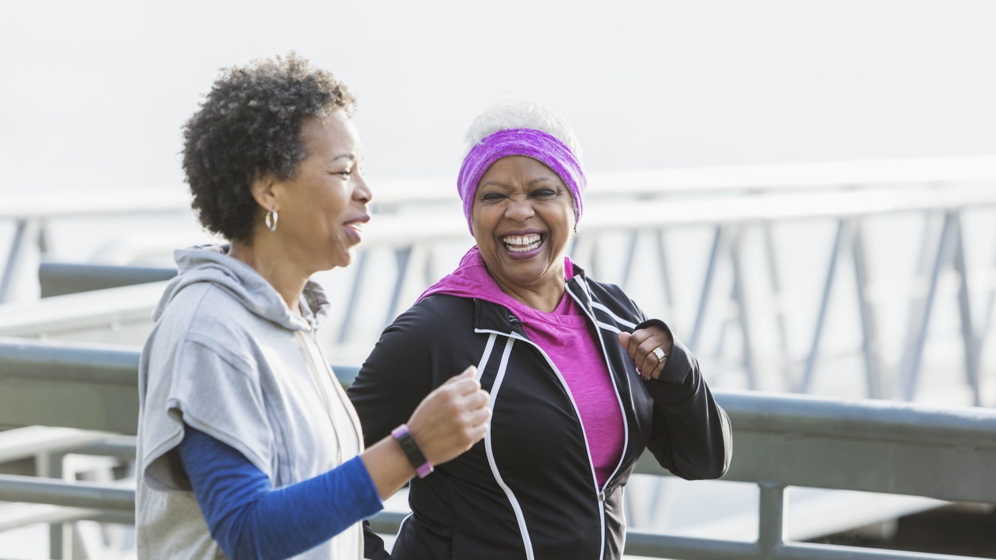 Two older African American women walking.