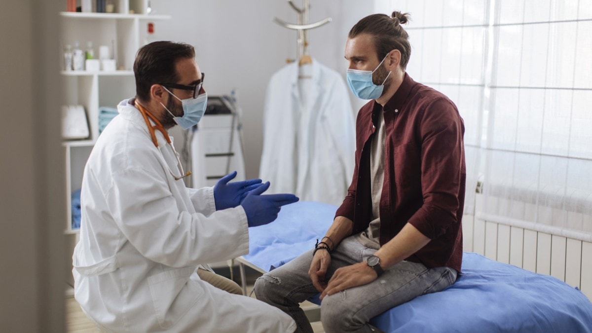 Photo of a man talking to his doctor