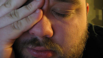 Man with a headache, showing symptoms of Q fever.