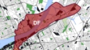 An arial view of a city map with colored shapes indicating areas of radioactive fallout.