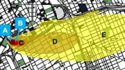 An arial view of a city map with colored circles and shapes indicating areas of blast/thermal damage and radiation exposure due to fallout.