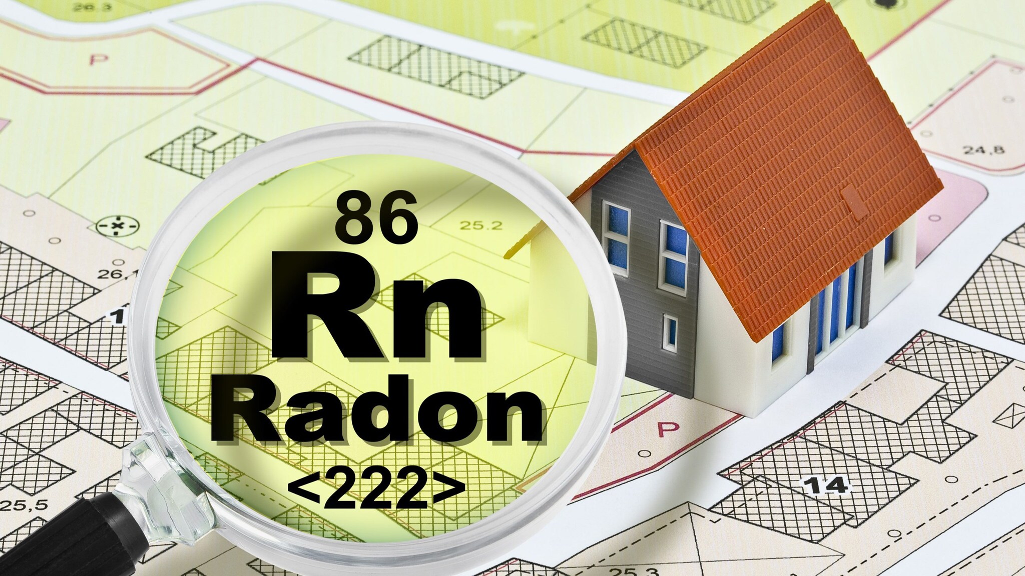 A gamepiece house sits on top of a neighborhood map. A magnifying glass hovers over the map with text in the lens that reads, "86 Rn Radon "