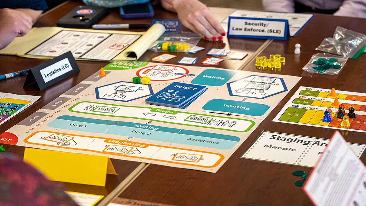 Closeup of TEST POD board with pieces around table.