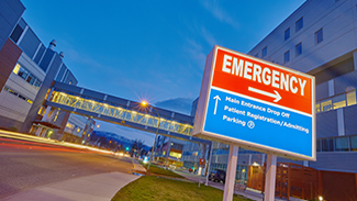 Hospital sign showing directions to emergency room
