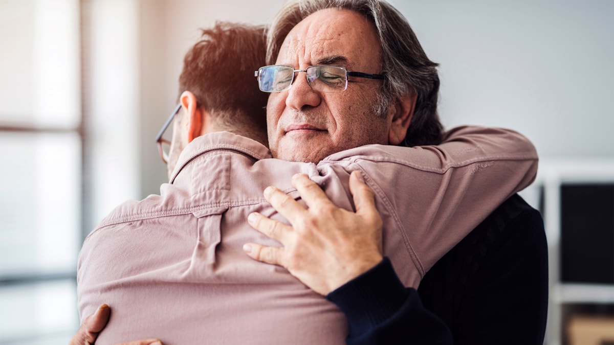 Two people hugging.