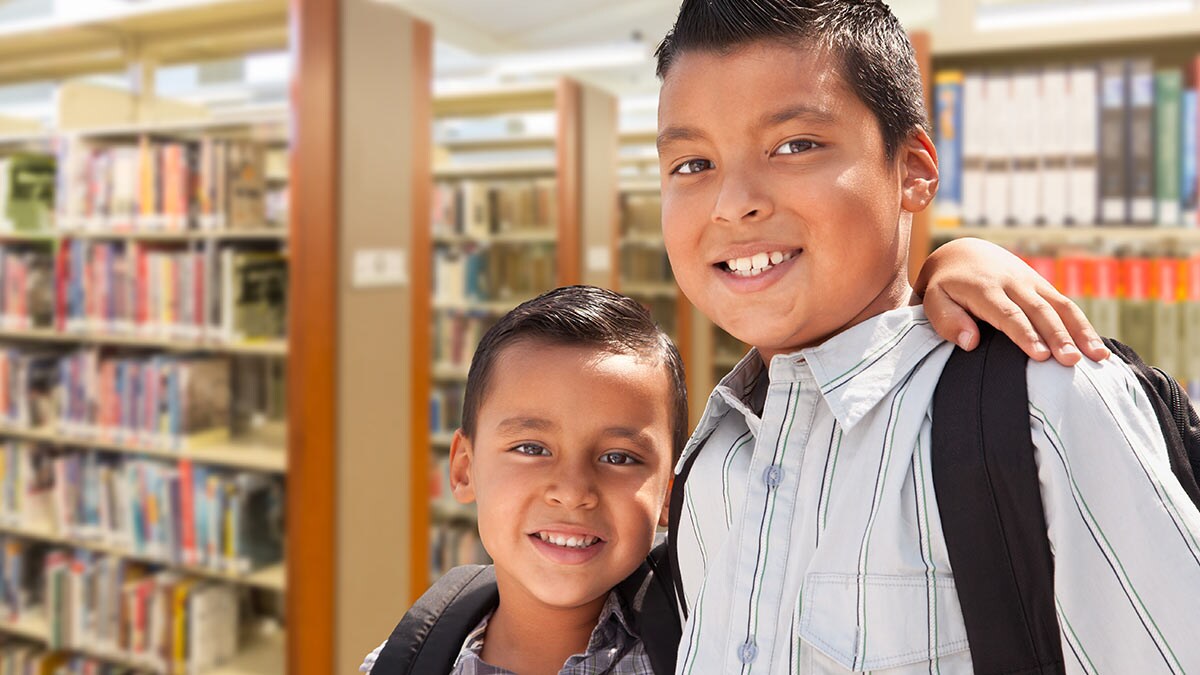 Young siblings in a library