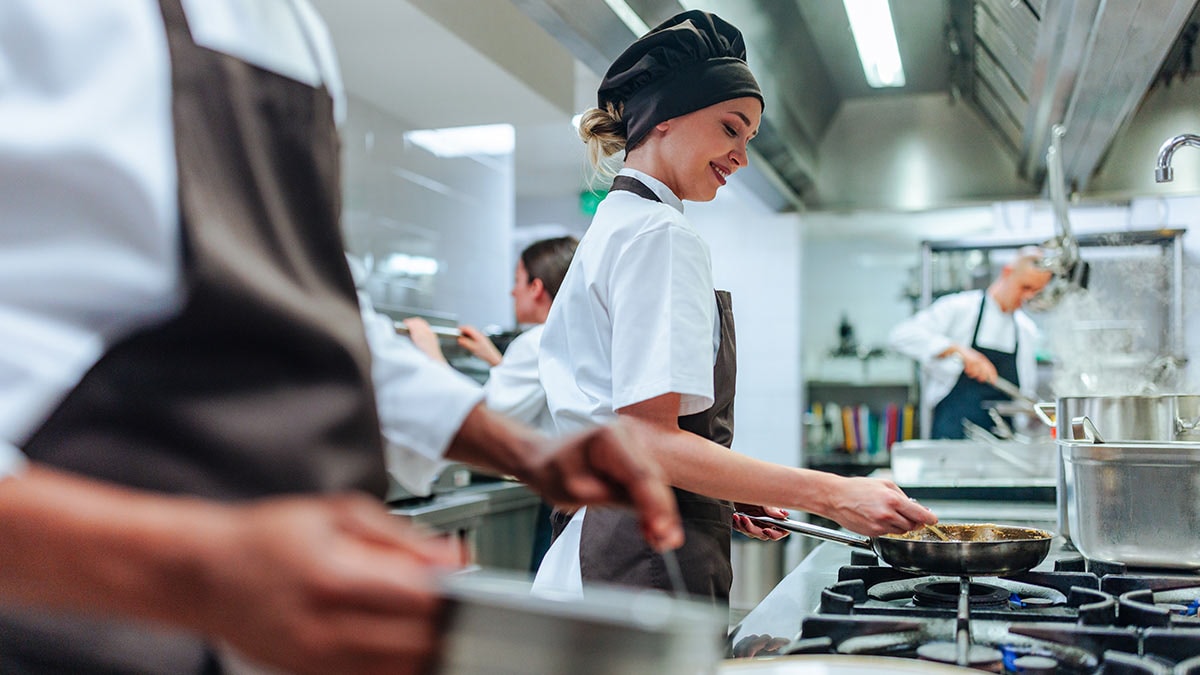 Woman working in a restaurant kitchen