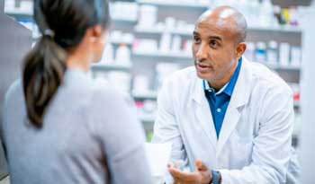 pharmacist helping patient